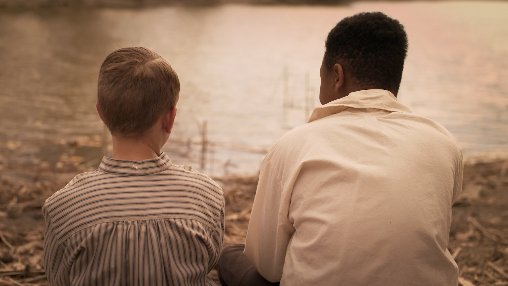 Still from the film Paul's Promise of a young boy and a man