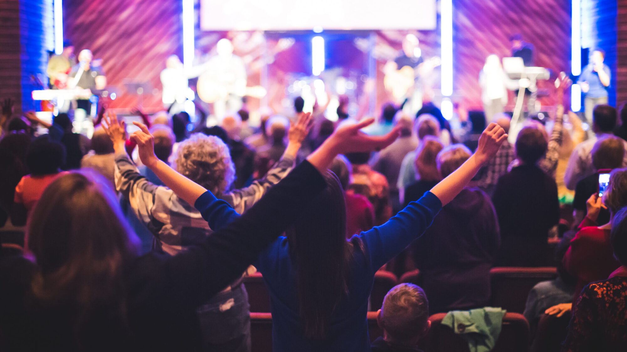 Crowd singing and worshiping