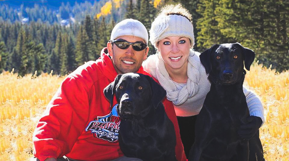 Couple with two labradors 