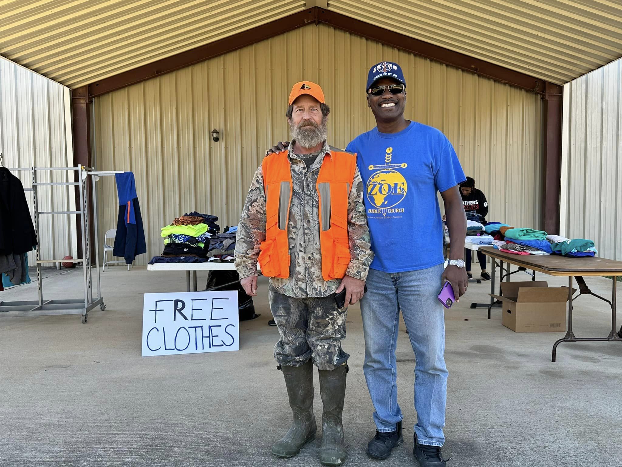 Pastor Iverson Jackson with man in hunting gear