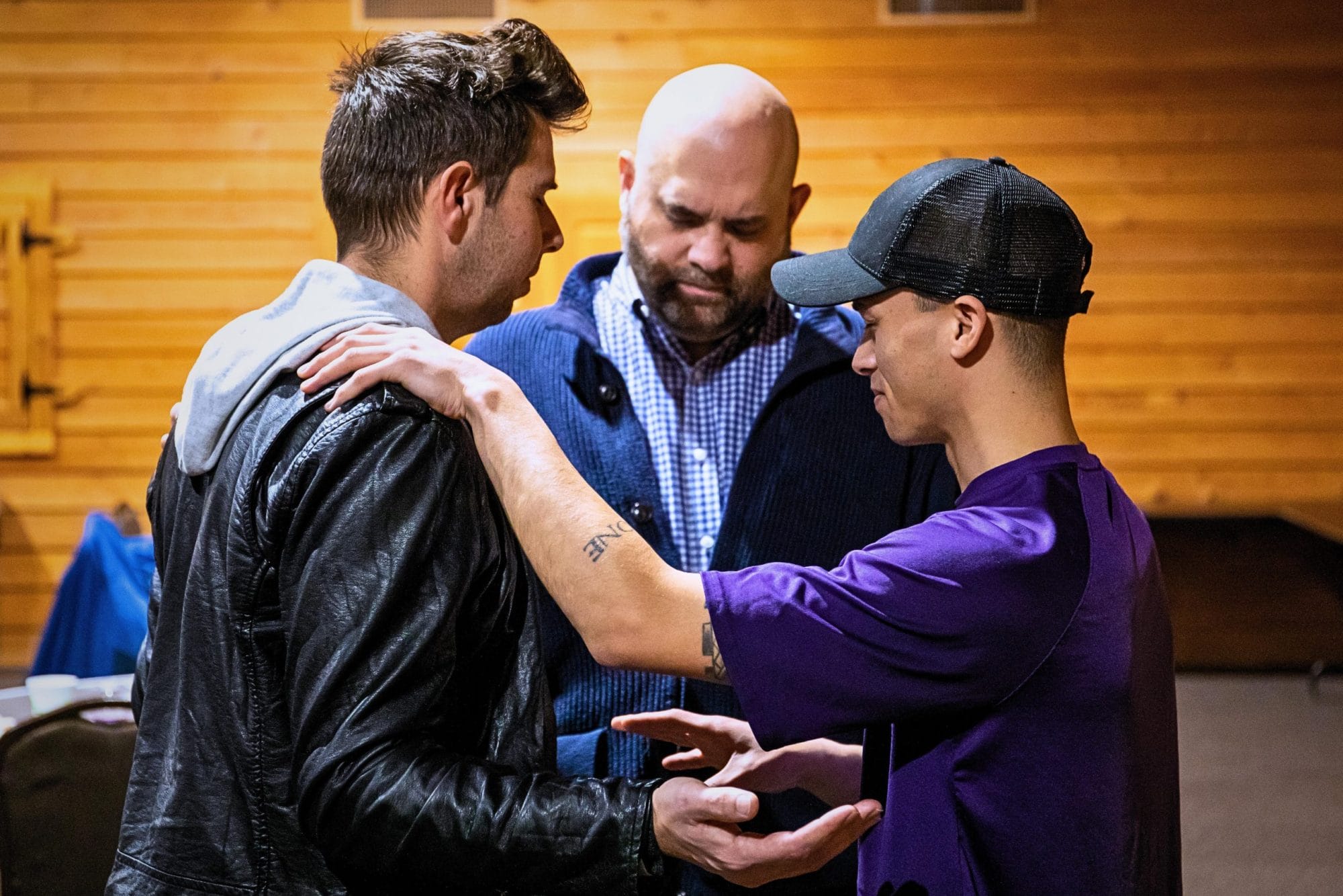 Men praying together