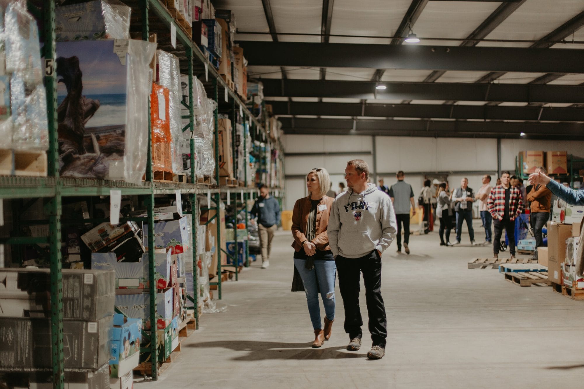 People checking shelves in warehouse