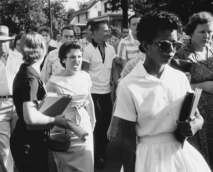Black student Elizabeth Eckford is jeered by white student Hazel Bryan as she attempts to enter Little Rock Central High School. Photo credit: Will Counts, Arkansas Democrat, via Wikimedia Commons.