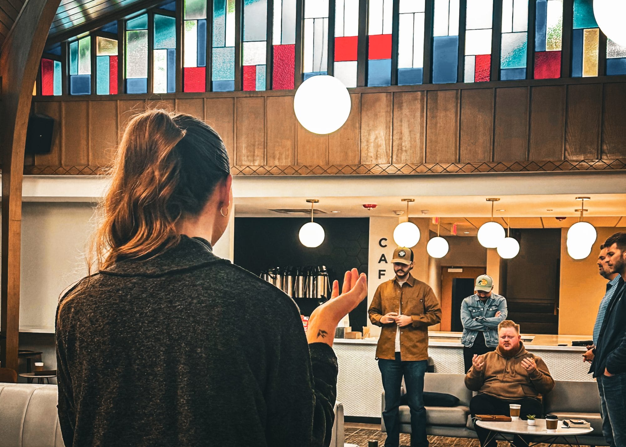 Prayer group in church atrium at Fellowship Midtown