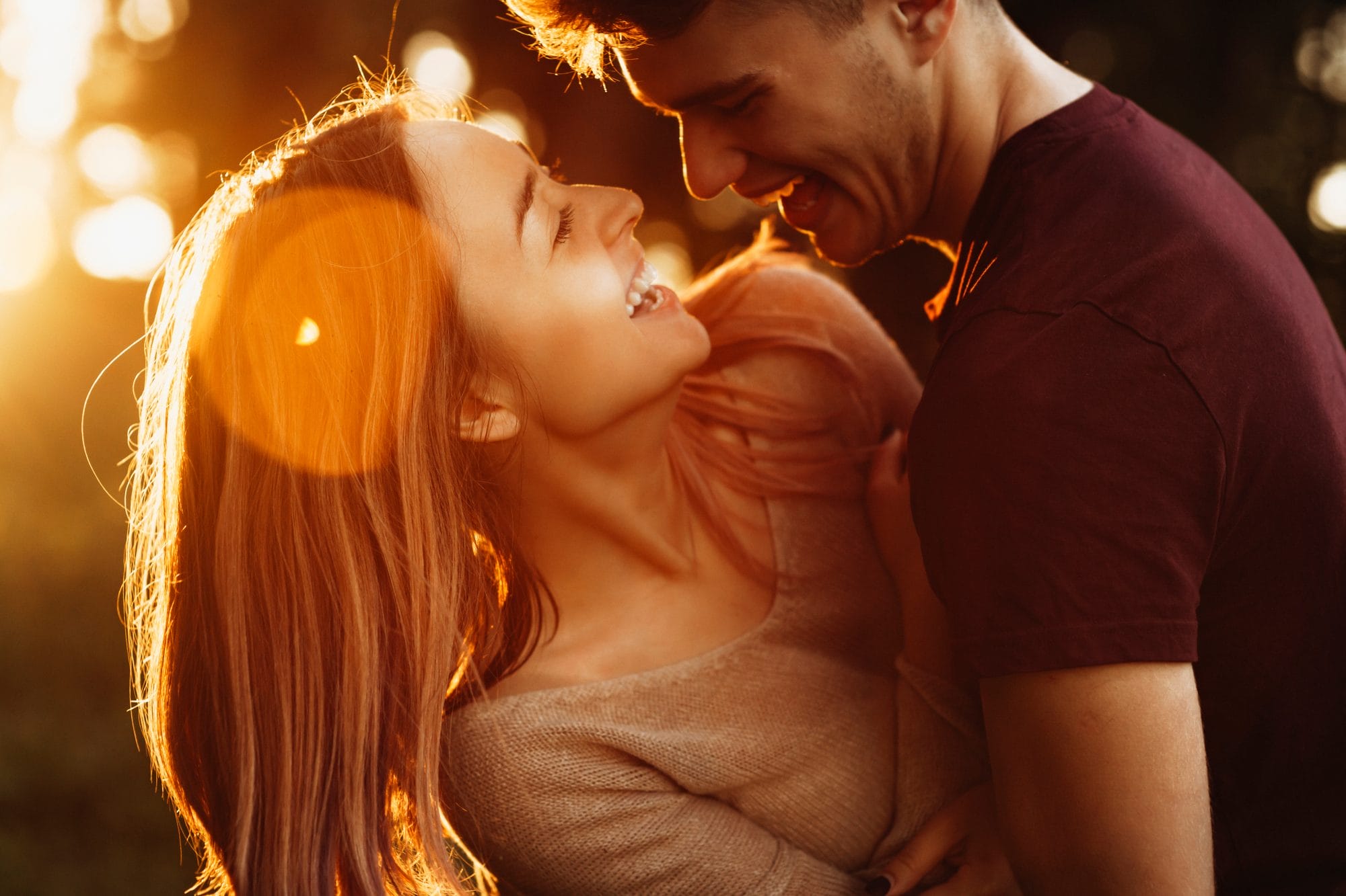 Couple holding each other and laughing