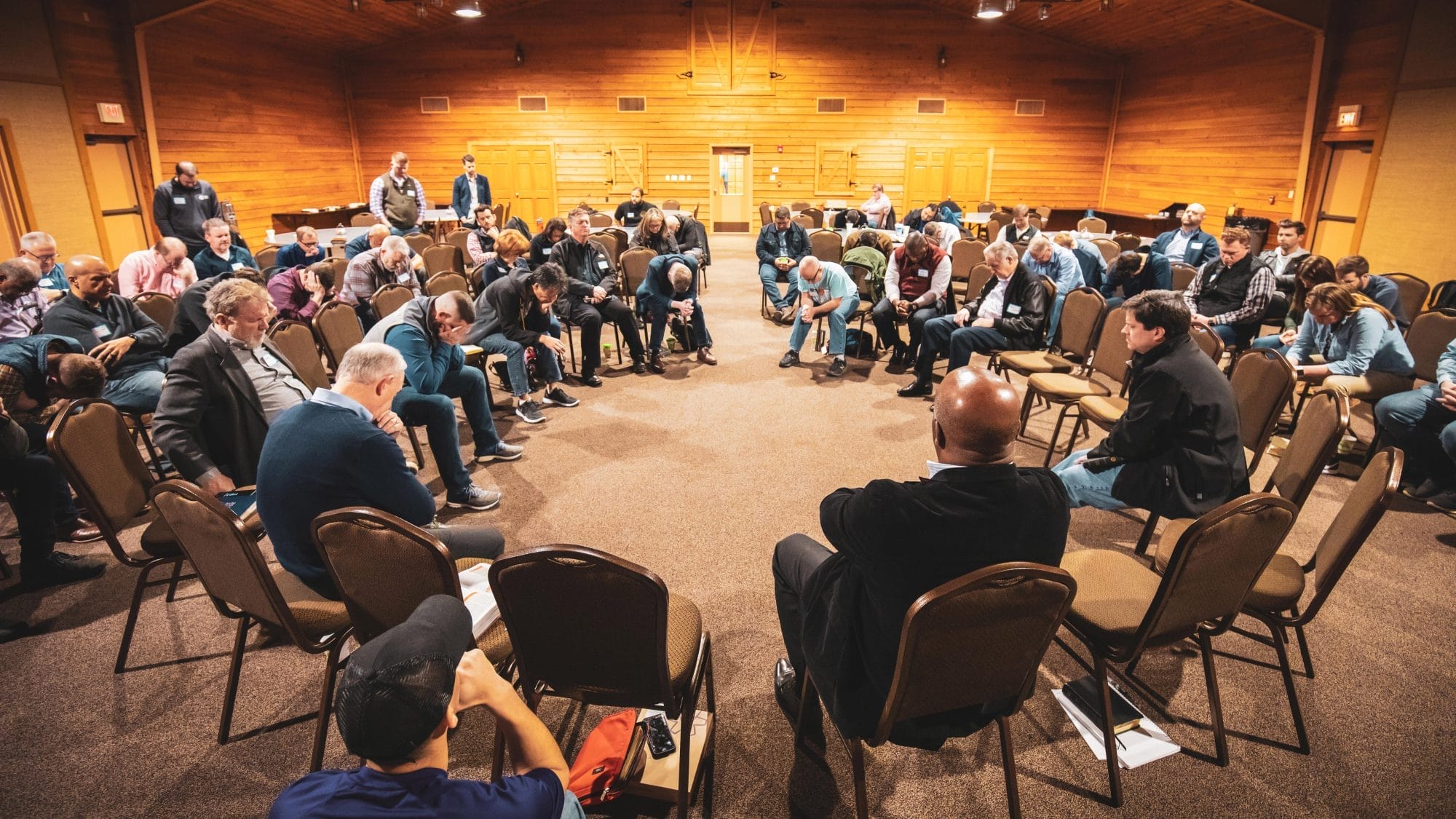 Pastors praying at the Arkansas Pastors Prayer Summit
