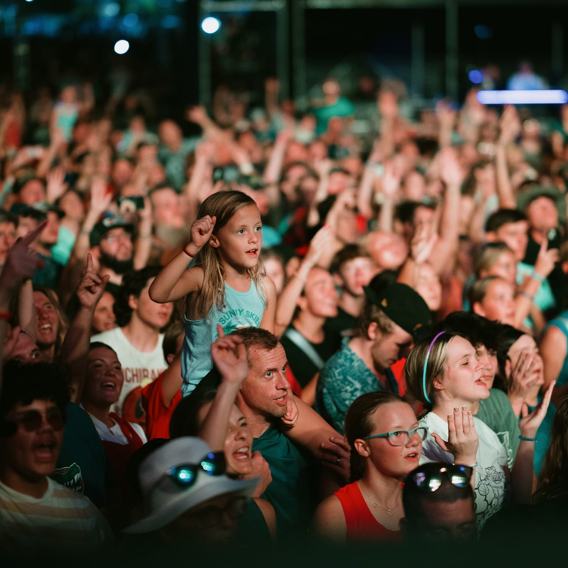 young girl in crowd at music festival