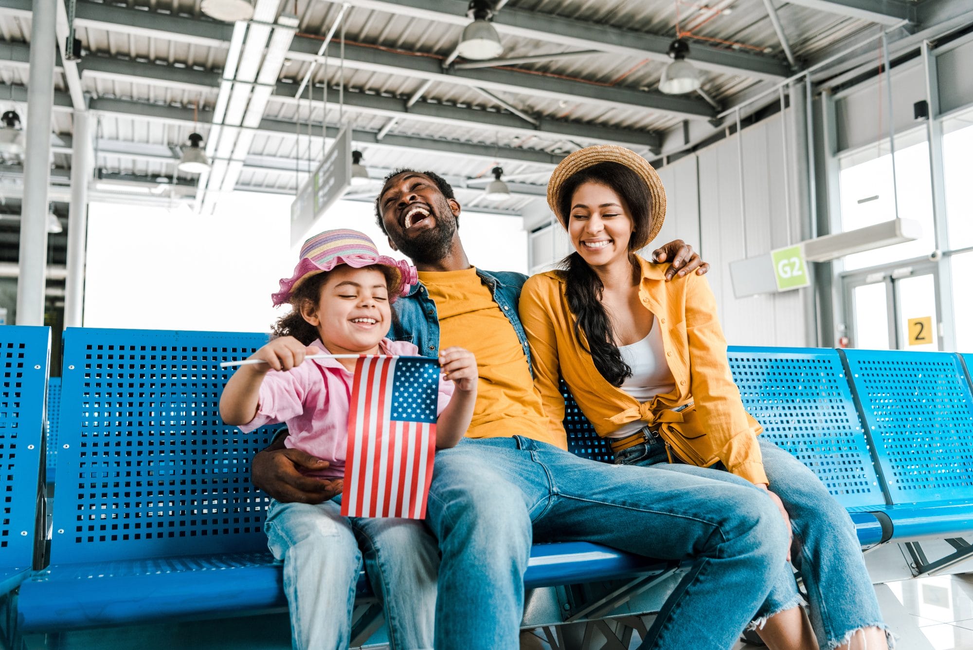 Family sitting on blue bench