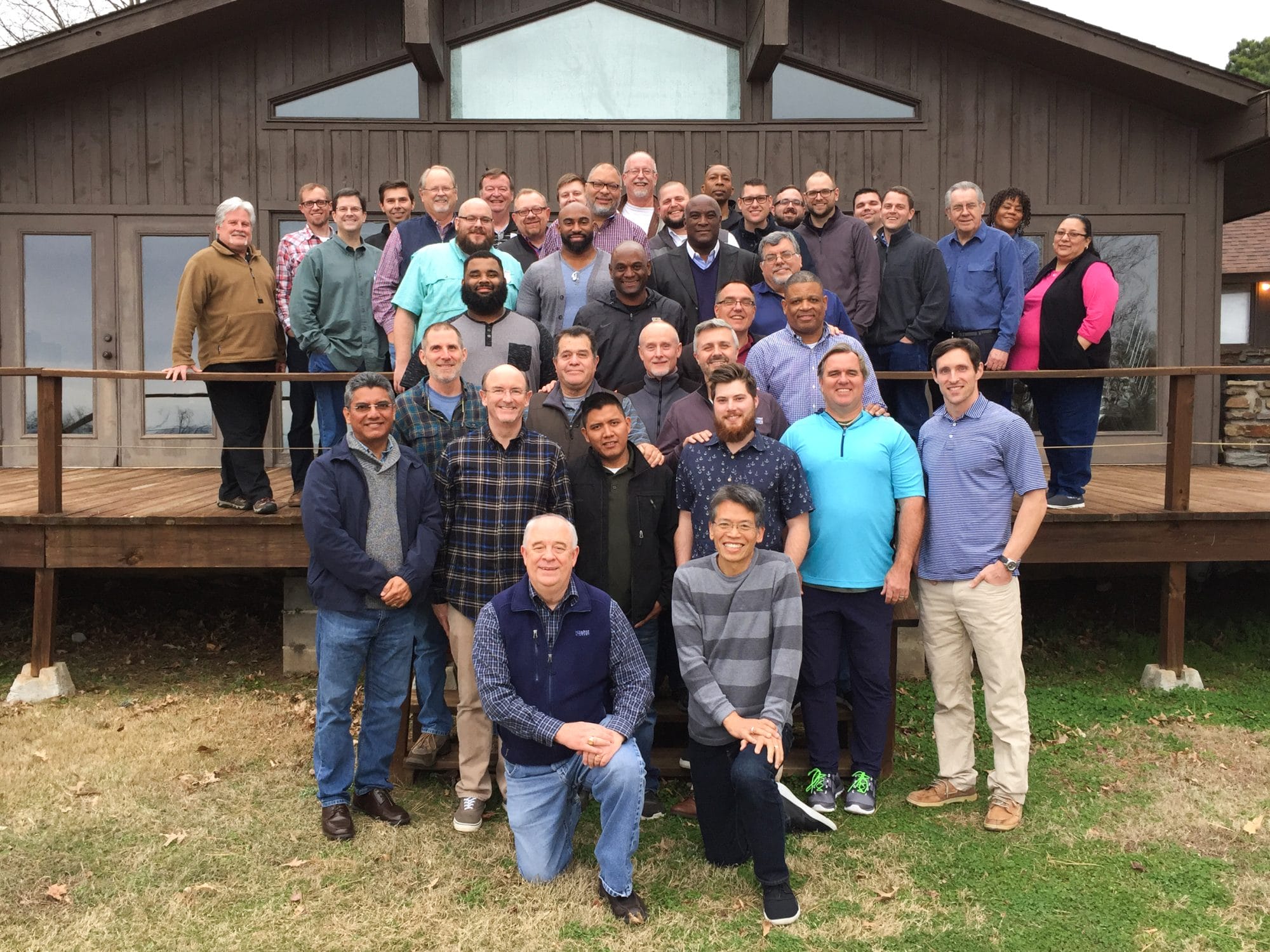 Group photo of men and women from the Arkansas Pastors Prayer Summit